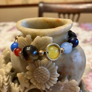 SOLAR STYLE THEMED BRACELET WITH ADJUSTABLE PULL CORD